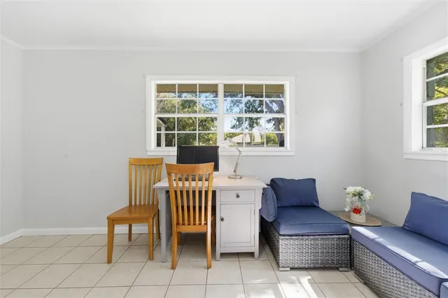 a view of a room with wooden floor and windows
