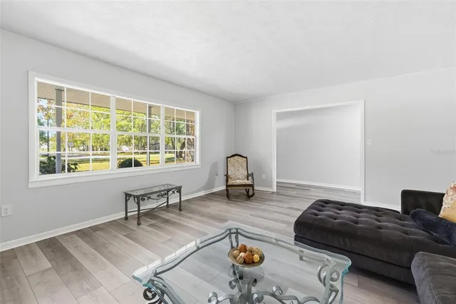 a living room with furniture and a window