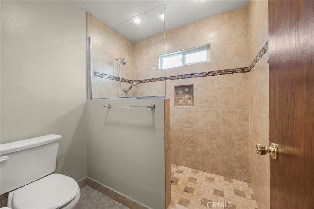 12342 Rea Circle Garden Grove, CA 92841 - Photo 21 of 27 a bathroom with a toilet and a shower