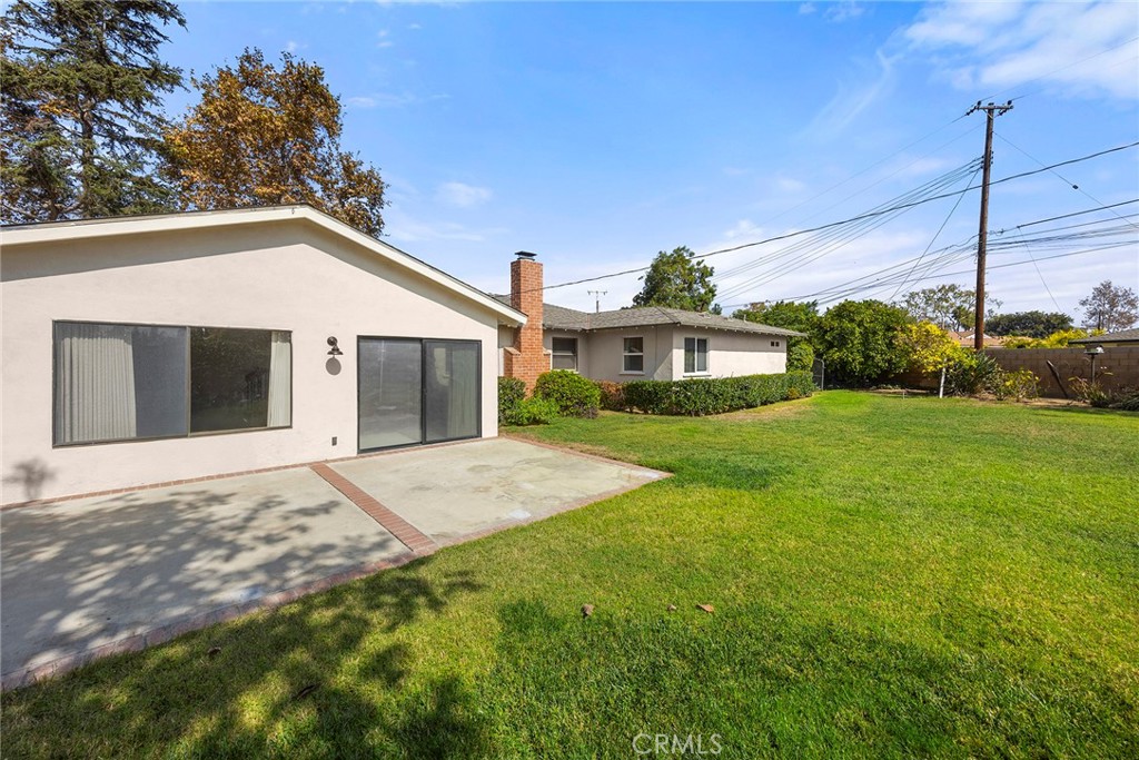 12342 Rea Circle Garden Grove, CA 92841 - Photo 23 of 27 a view of a house next to a yard with potted plants