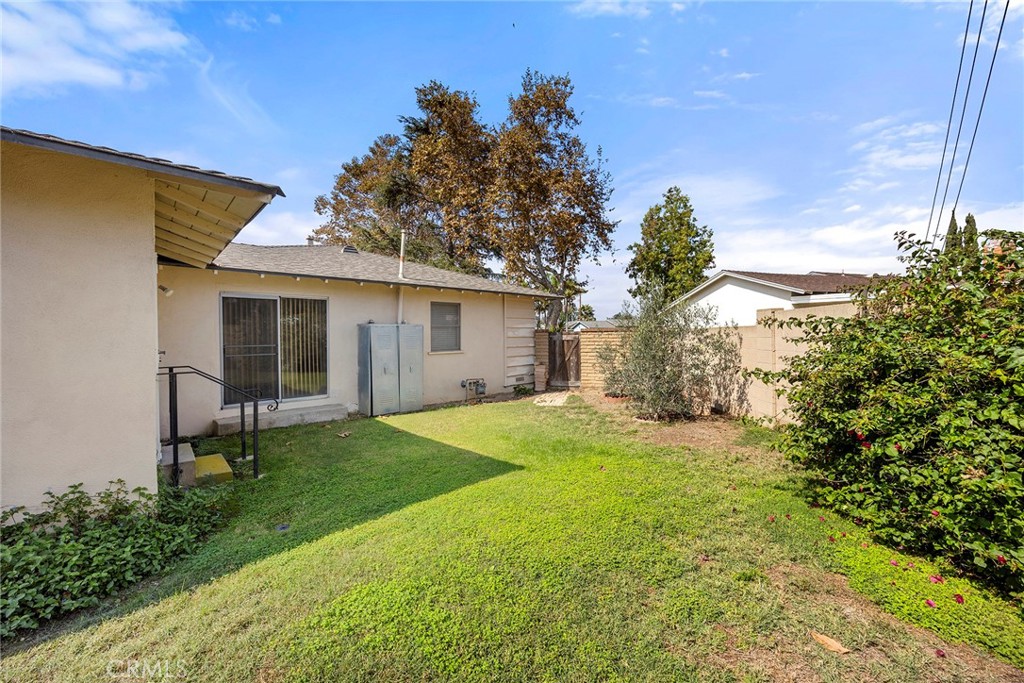 12342 Rea Circle Garden Grove, CA 92841 - Photo 26 of 27 a backyard of a house with table and chairs