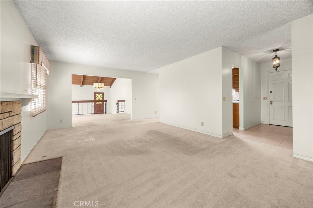 12342 Rea Circle Garden Grove, CA 92841 - Photo 3 of 27 a view of a kitchen with a sink and a refrigerator