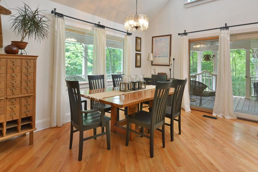 544 Lockamy Road Timberlake, NC 27583 - Photo 15 of 47 a view of a dining room with furniture window and wooden floor