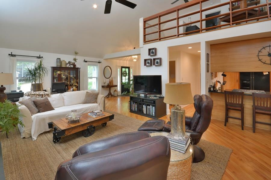 544 Lockamy Road Timberlake, NC 27583 - Photo 18 of 47 a living room with furniture and a flat screen tv