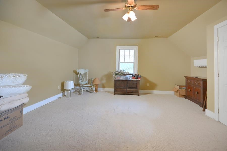 544 Lockamy Road Timberlake, NC 27583 - Photo 29 of 47 a living room with furniture and a chandelier