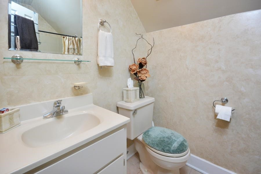 544 Lockamy Road Timberlake, NC 27583 - Photo 30 of 47 a bathroom with a sink toilet and a mirror