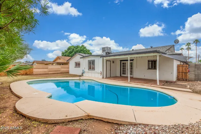 a view of a house with swimming pool