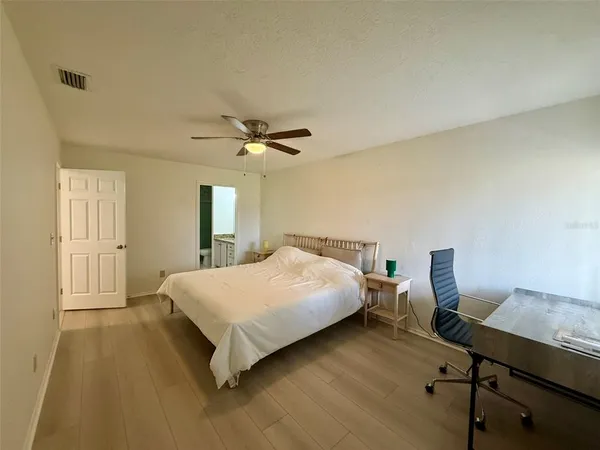 a bedroom with a bed and a table