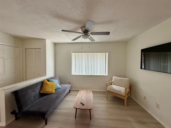 a living room with furniture and a window