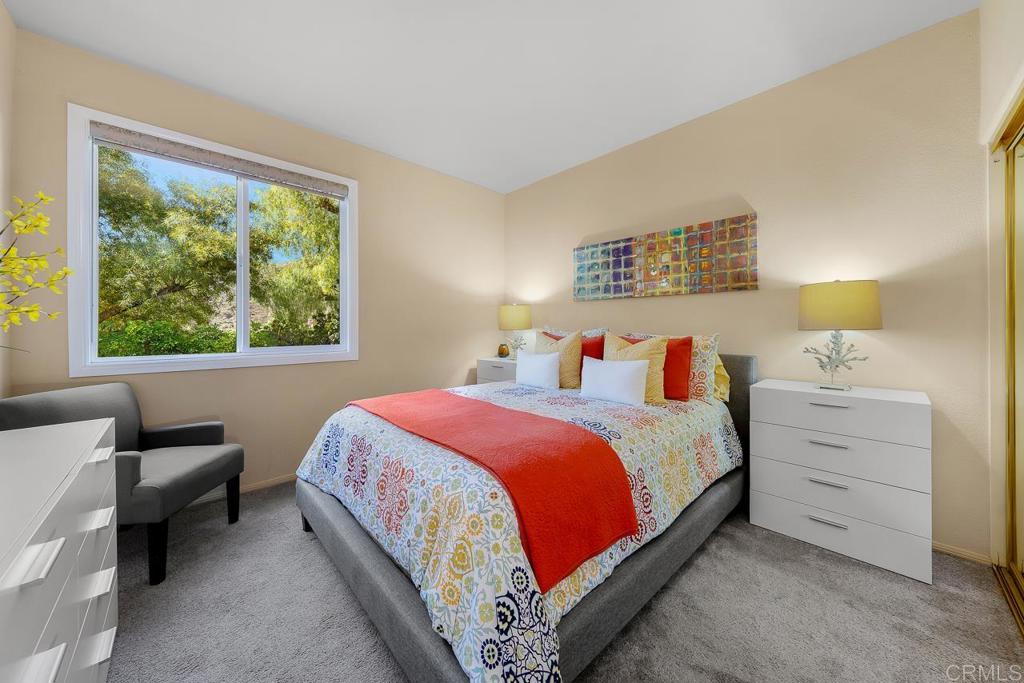3762 Hidden Ridge Road Jamul, CA 91935 - Photo 18 of 29 a bedroom with a bed and a window