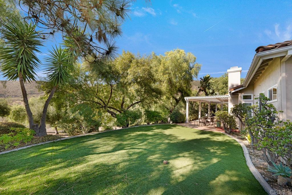 3762 Hidden Ridge Road Jamul, CA 91935 - Photo 25 of 29 a view of a house with a yard