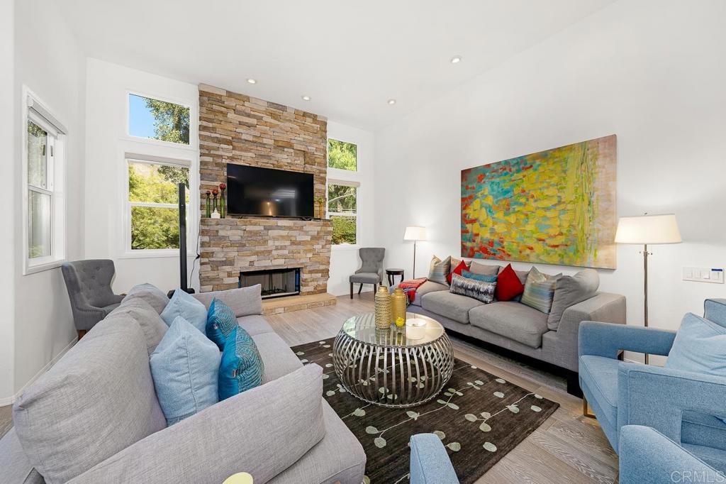 3762 Hidden Ridge Road Jamul, CA 91935 - Photo 4 of 29 a living room with furniture a fireplace and a flat screen tv