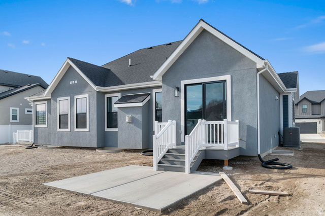 11673 South Halls Crk Road Draper, UT 84020 - Photo 4 of 22 Rear exterior featuring a concrete patio, composite deck with white railings, and a sliding glass door