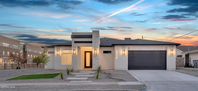 a kitchen with stainless steel appliances granite countertop a refrigerator and a stove