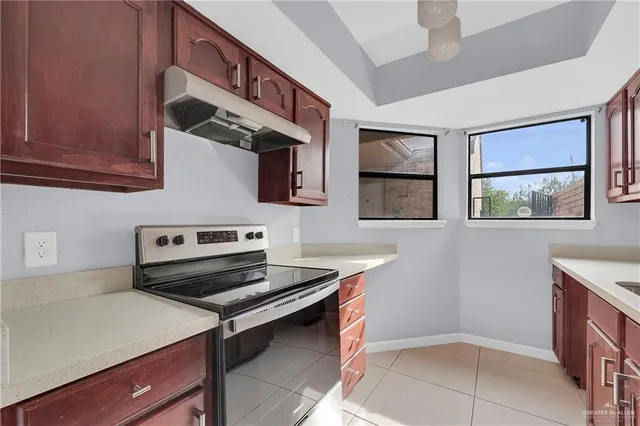 a kitchen with a stove and a microwave