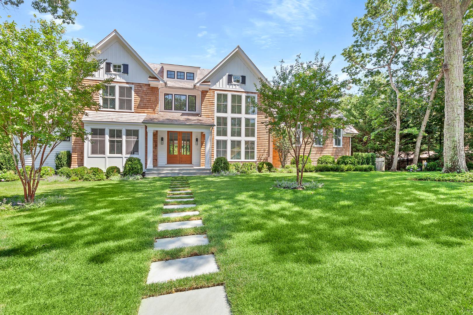 a front view of a house with a yard