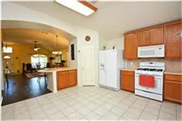 a large bathroom with a double vanity sink a mirror a bathtub and shower