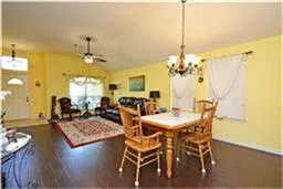 a kitchen with stainless steel appliances granite countertop a stove sink and cabinets