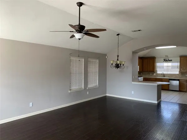 a kitchen with a sink cabinets and window