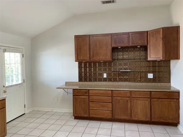 a kitchen with stainless steel appliances a refrigerator a stove top oven a sink and dishwasher