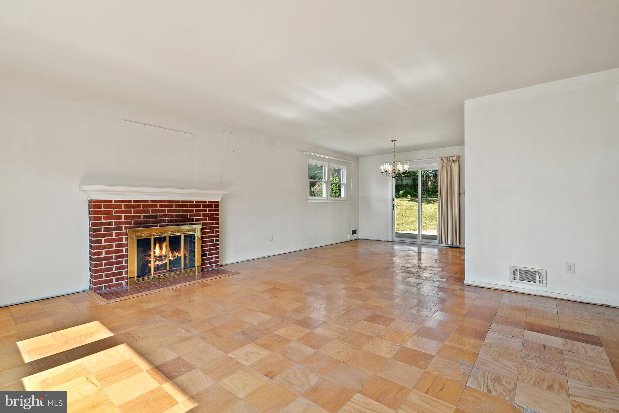 5323 Ravensworth Road Springfield, VA 22151 - Photo 2 of 32 Living room with wood burning fireplace