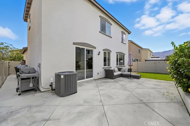 a view of a backyard with sitting area