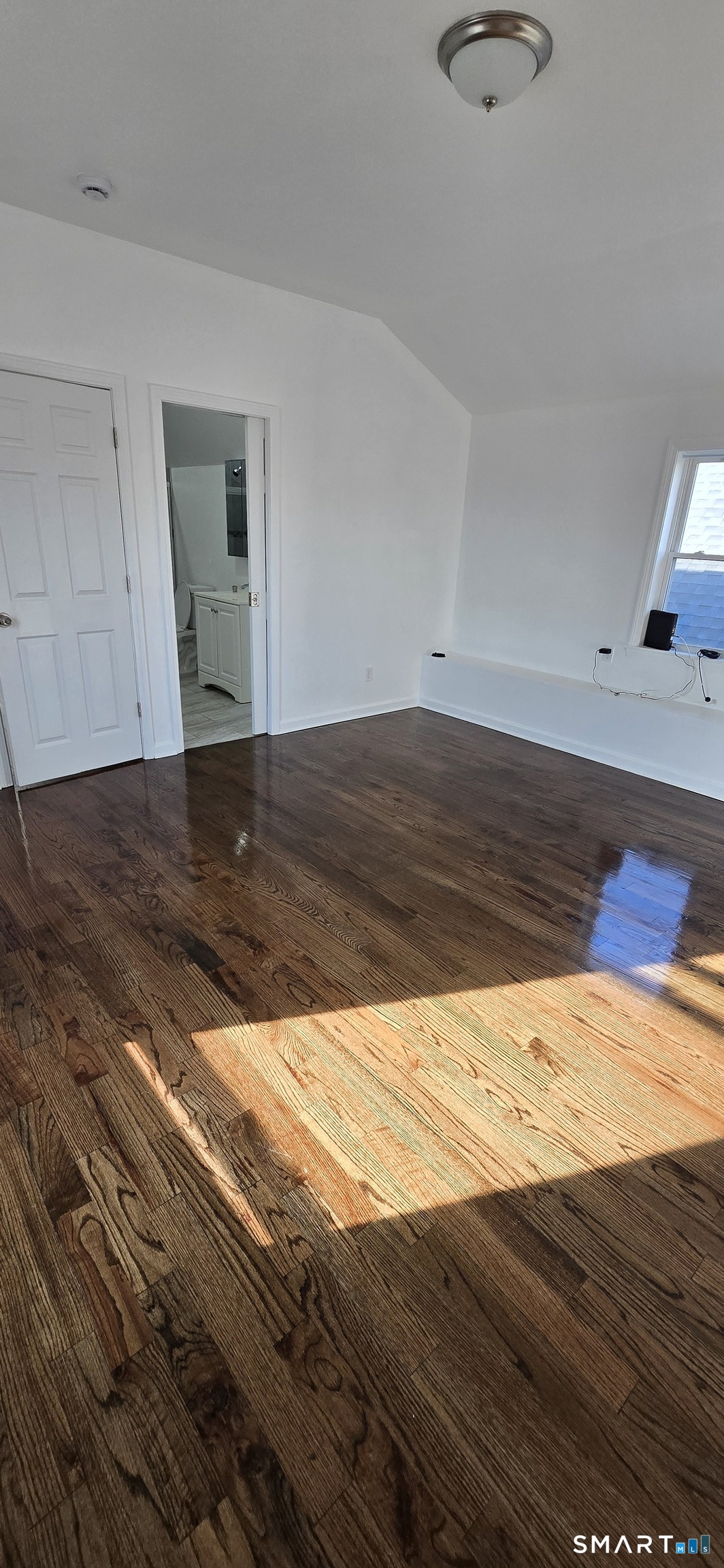99 Johnson Street, Unit 2 Bridgeport, CT 06604 - Photo 11 of 12 a view of empty room with wooden floor