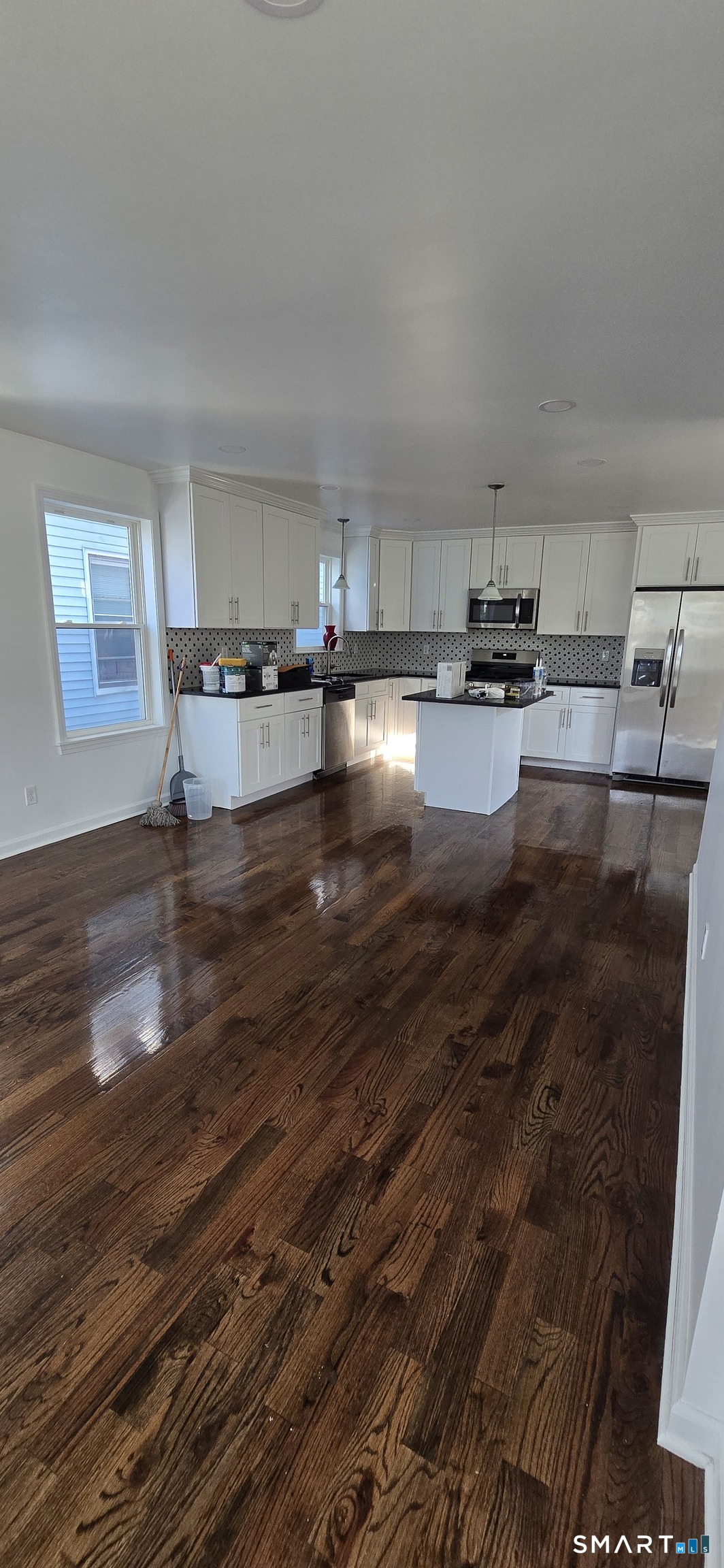 99 Johnson Street, Unit 2 Bridgeport, CT 06604 - Photo 2 of 12 a view of kitchen and kitchen island