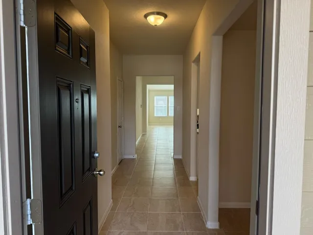 a kitchen with stainless steel appliances granite countertop a refrigerator and a stove