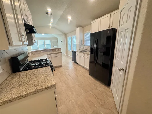 a view of a livingroom with a ceiling fan and window