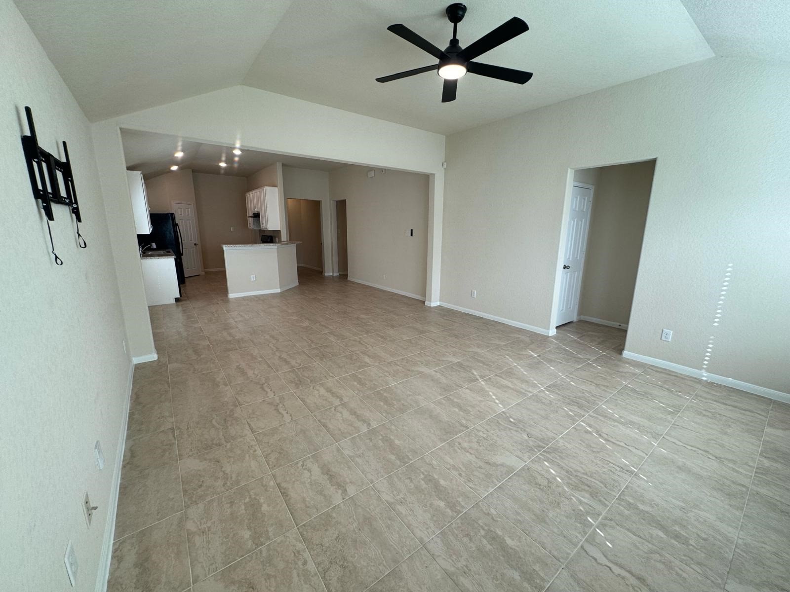 18323 Spruce Tree Line Trail Houston, TX 77084 - Photo 6 of 17 a view of a livingroom with a ceiling fan and window
