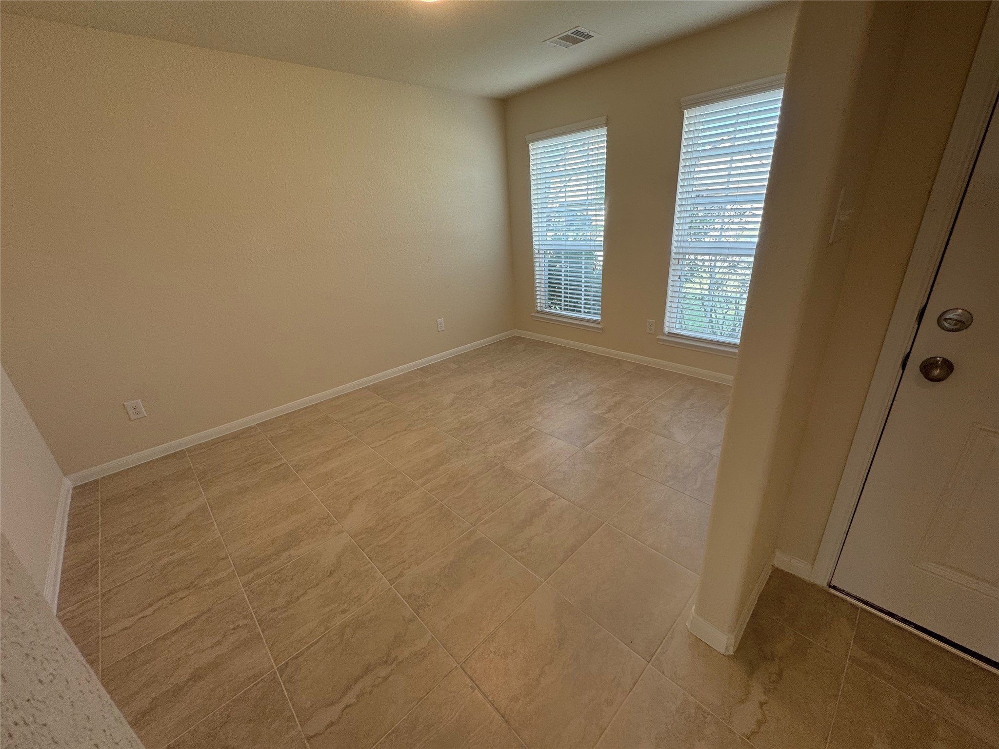 18323 Spruce Tree Line Trail Houston, TX 77084 - Photo 8 of 17 an empty room with windows