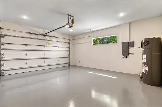 a bathroom with a double vanity sink mirror and bathtub
