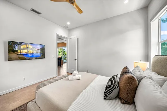 a bathroom with a toilet a sink and a mirror