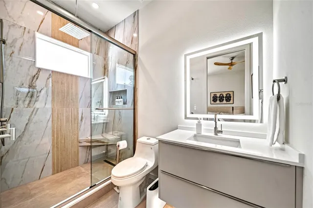 a bedroom with a large bed and a large window