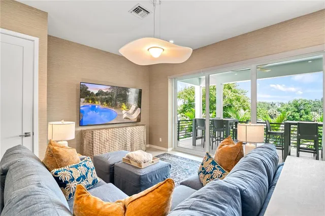 a building outdoor space with patio furniture and potted plants
