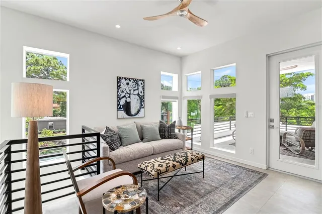 an aerial view of a house with a yard and trees