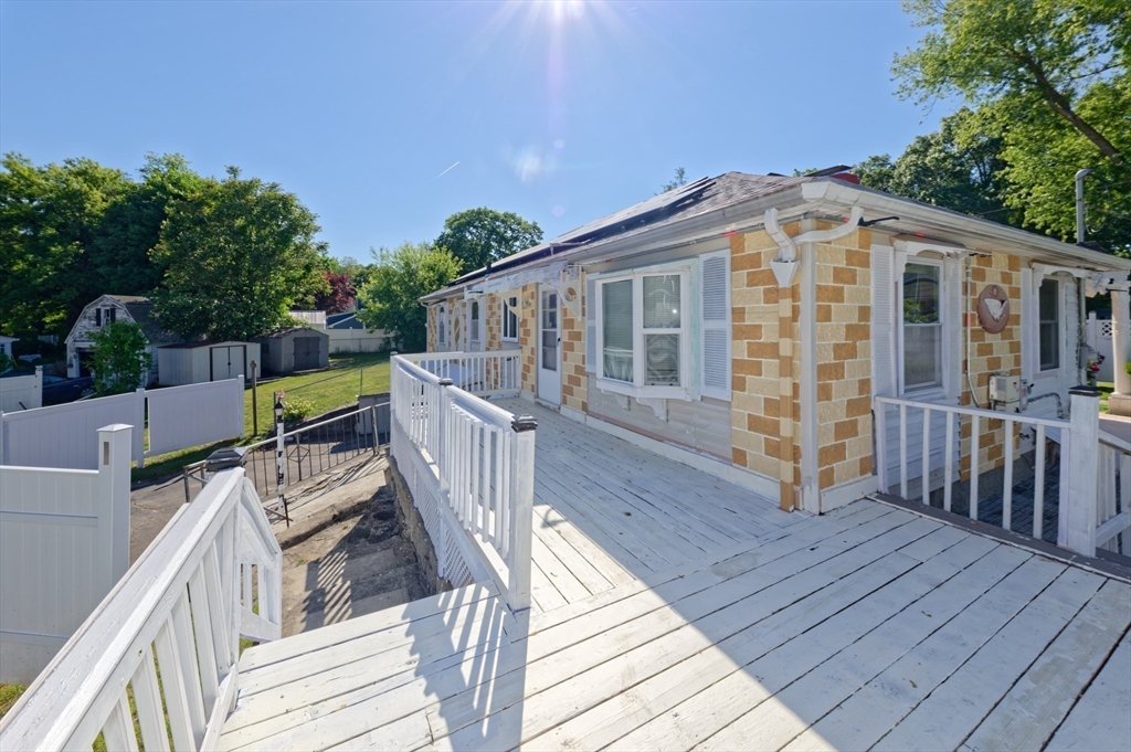 1 Rockland Rd Court Auburn, MA 01501 - Photo 34 of 38 a view of a house with wooden deck and furniture
