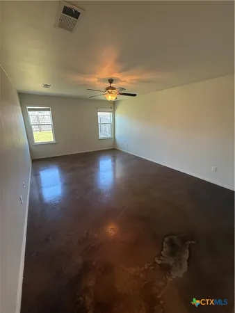 an empty room with a empty space and a window