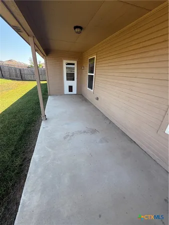 a view of empty room with windows