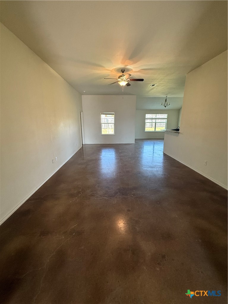 4405 Texas Rangers Drive Killeen, TX 76549 - Photo 8 of 22 an empty room with wooden floor and windows in it