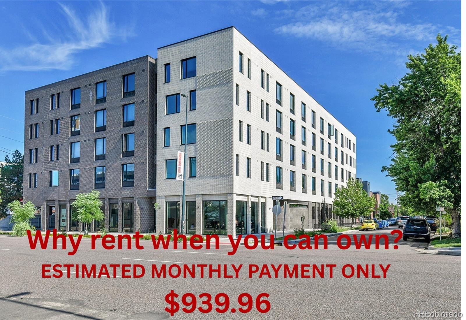 a sign on street next to a building