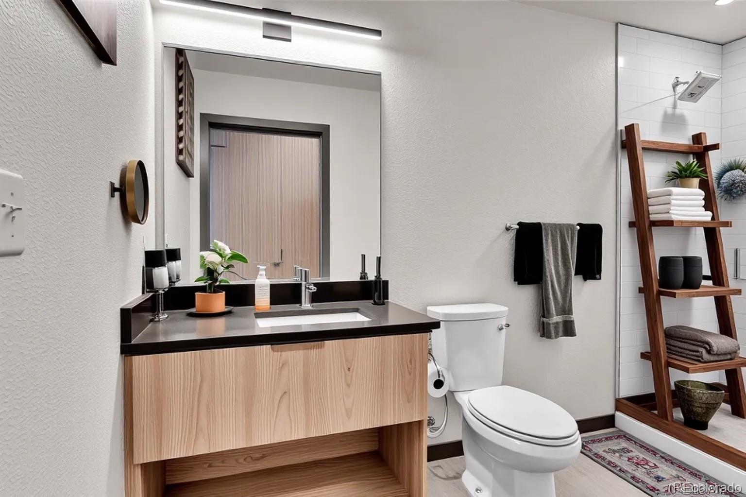603 Inca Street, Unit 301 Denver, CO 80204 - Photo 11 of 12 a bathroom with a granite countertop sink a toilet and a mirror