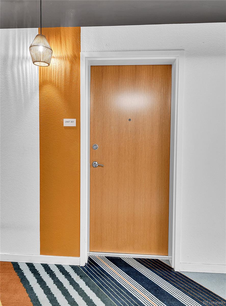 603 Inca Street, Unit 301 Denver, CO 80204 - Photo 6 of 12 a view of room with wooden floor