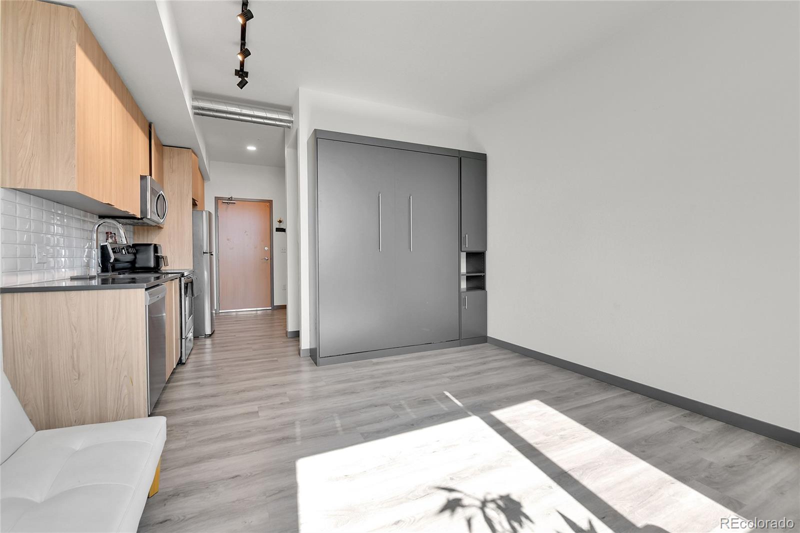 603 Inca Street, Unit 301 Denver, CO 80204 - Photo 10 of 12 a view of a kitchen from the hallway