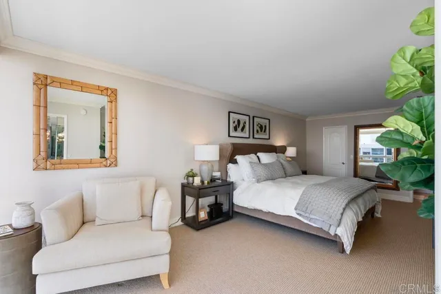 a bedroom with a bed and a couch