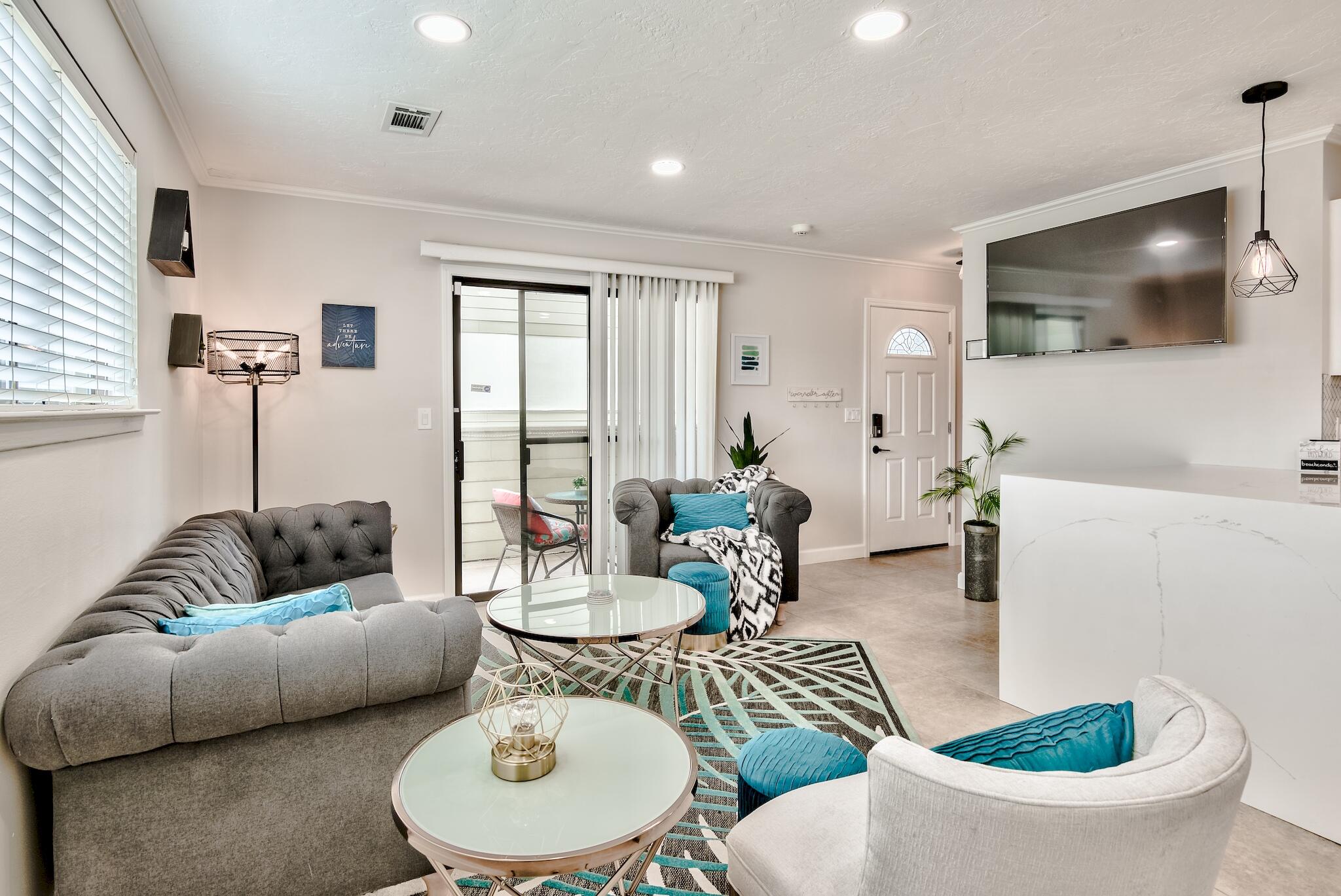 a living room with furniture and a flat screen tv