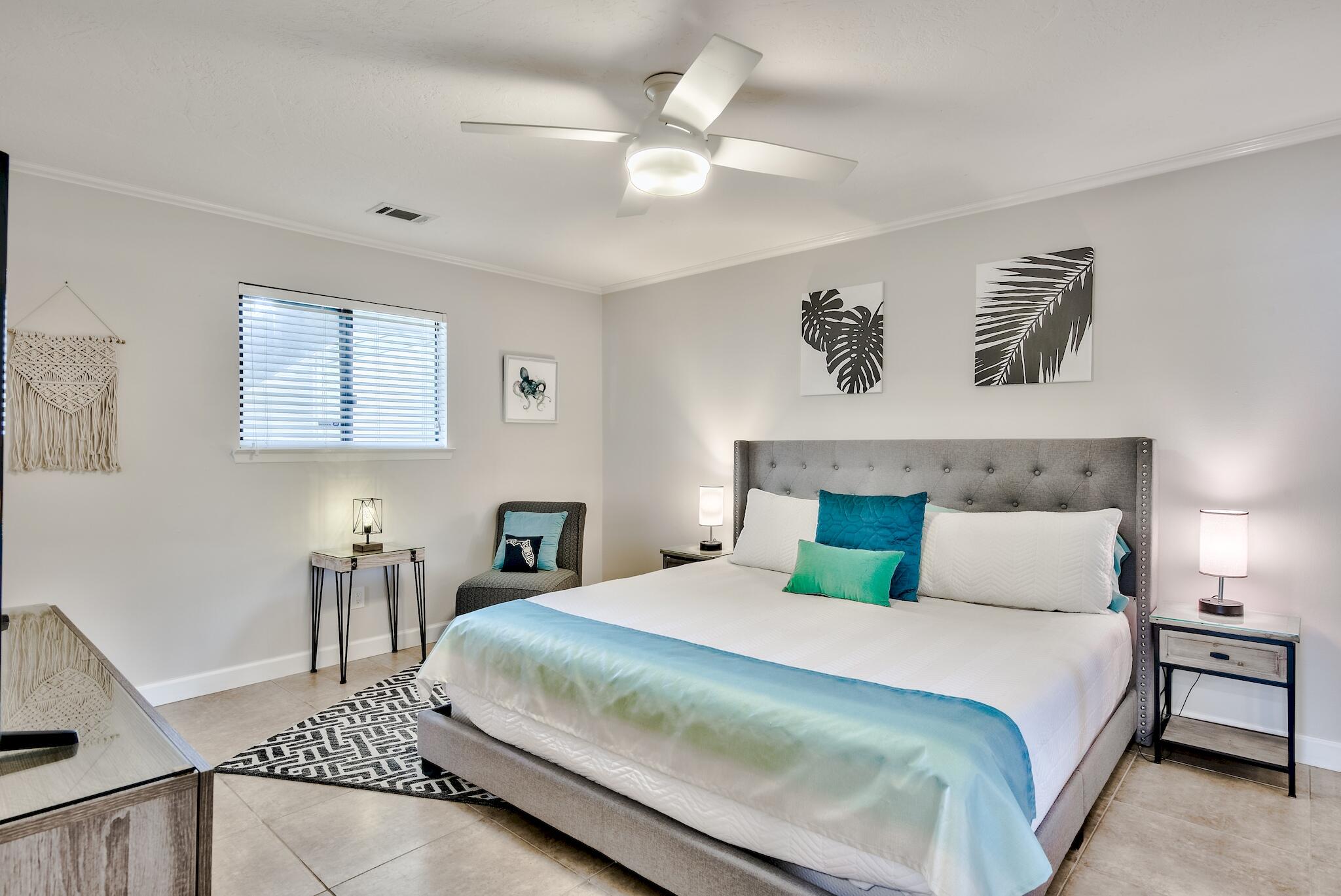 64 Cross Creek Road, Unit 11 Miramar Beach, FL 32550 - Photo 11 of 20 a bedroom with a large bed and a chandelier
