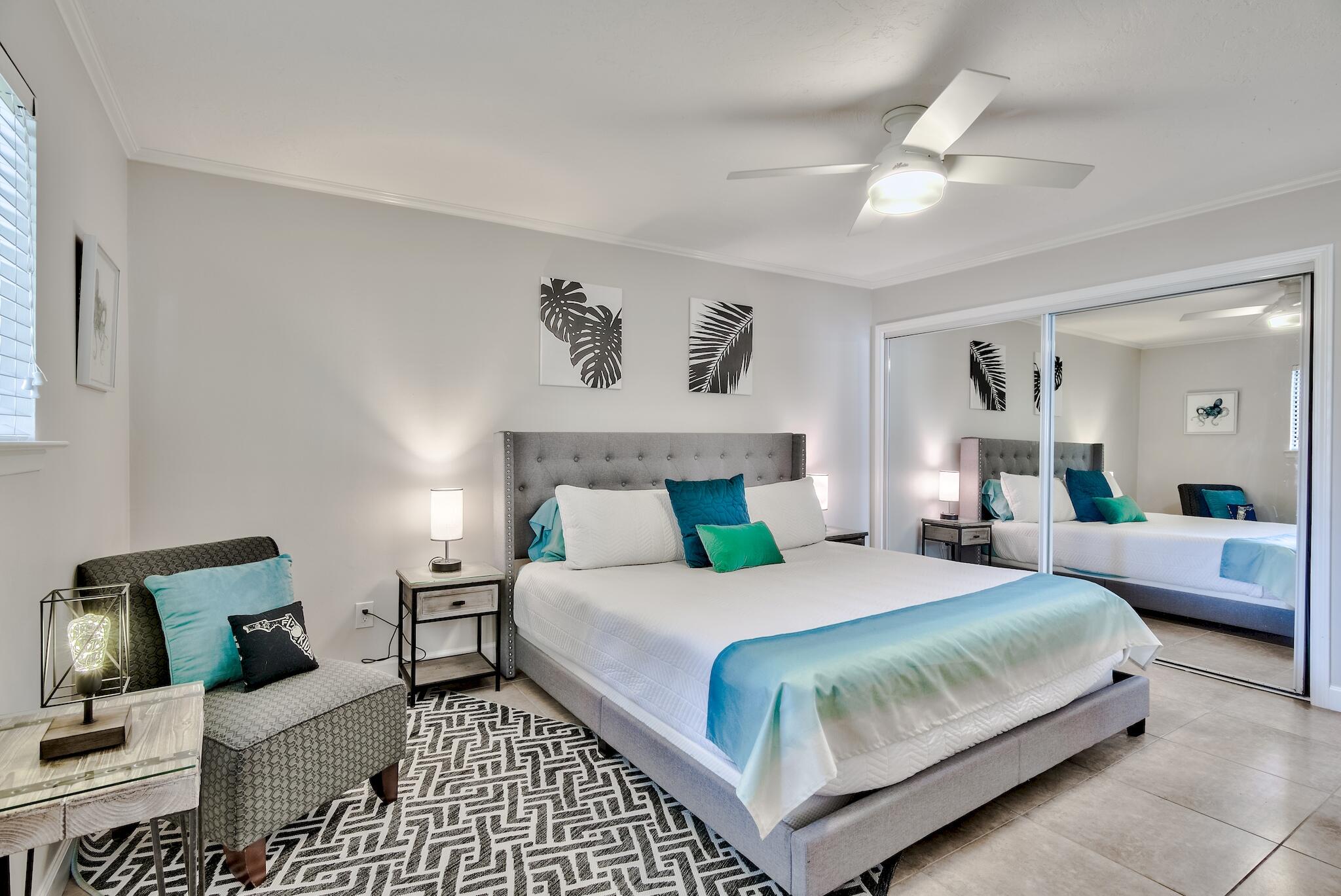 64 Cross Creek Road, Unit 11 Miramar Beach, FL 32550 - Photo 13 of 20 a bedroom with a large bed and a couch