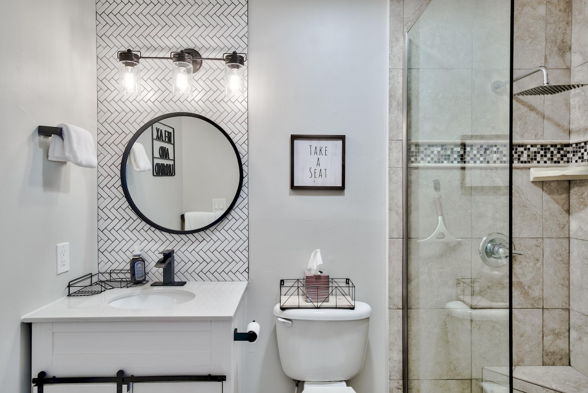 64 Cross Creek Road, Unit 11 Miramar Beach, FL 32550 - Photo 14 of 20 a bathroom with a toilet sink and mirror